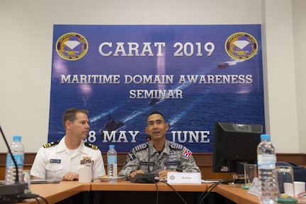 190530-N-SB587-1166 SATTAHIP, Thailand (May 30, 2019) U.S. Navy Lt. Cmdr. Todd Hutchins, staff judge advocate assigned to Commander, Logistics Group Western Pacific, and Royal Thai Navy Capt. Yuthanavi Mungthanya, commanding officer of HTMS Bandpakong (FFG 456), participate in a maritime domain awareness seminar during Cooperation Afloat Readiness and Training (CARAT) Thailand 2019. During the seminar, participants discussed international maritime laws and their impact on how nations operate in the region. This year marks the 25th iteration of CARAT, a multinational exercise series designed to enhance U.S. and partner navies' abilities to operate together in response to traditional and non-traditional maritime security challenges in the Indo-Pacific region.