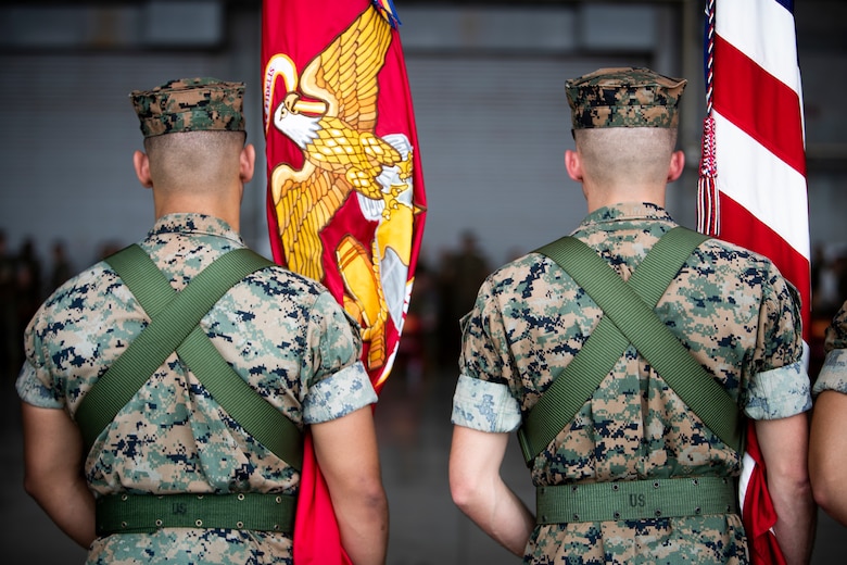 U.S. Marines post colors during a change of command ceremony June 21, 2019 at Marine Corps Air Station Futenma. The change of command ceremony was held in honor of U.S. Marine Corps Lt. Col Brian Ashford relinquishing his duties as commanding officer of Headquarters and Headquarters Squadron, Marine Corps Installations Pacific, to Lt. Col. Eric Starr. (U.S. Marine Corps photo by Lance Cpl. Savannah Mesimer)