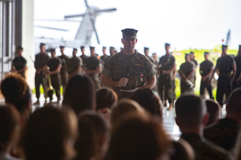 U.S. Marine Corps Lt. Col. Brian Ashford, former commanding officer of Headquarters and Headquarters Squadron, delivers a speech during a change of command ceremony June 21, 2019 at Marine Corps Air Station Futenma, Okinawa, Japan. Ashford relinquished his duties as Headquarters and Headquarters Squadron commanding officer to U.S. Marine Corps Lt. Col. Eric Starr. (U.S. Marine Corps photo by Lance Cpl. Savannah Mesimer)
