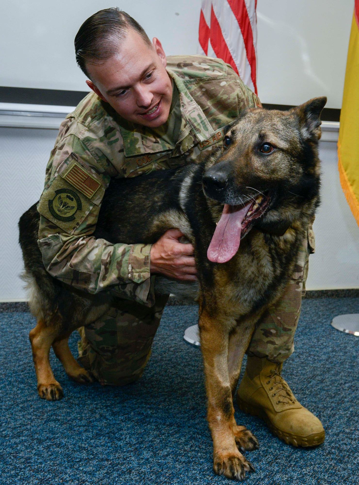 U.S. Air Force Tech. Sgt. Chad Coe, 86th Security Forces Squadron military working dog handler, hugs Charone, 86th SFS MWD, during Charone’s retirement ceremony at Ramstein Air Base, Germany, May 18, 2019. During his nine years of honorable service, Charone showcased his capabilities in 22 demonstrations, deployed to Kuwait in support of Operation Inherent Resolve, and supported multiple missions protecting the president of the United States and secretary of defense