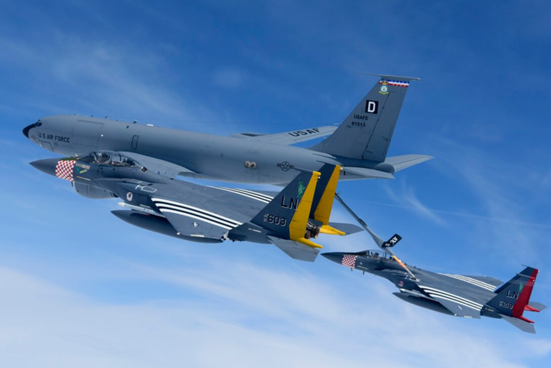F-15E Strike Eagles assigned to the 48th Fighter Wing conduct in-flight refuelling over the English channel with a KC-135 Stratotanker assigned to the 100th Air Refueling Wing in support of the 75th anniversary of D-Day June 9, 2019. An epic multinational operation, D-Day forged partnerships and reinforces trans-Atlantic bonds that remain to this day. (U.S. Air Force photo/ Tech. Sgt. Matthew Plew)