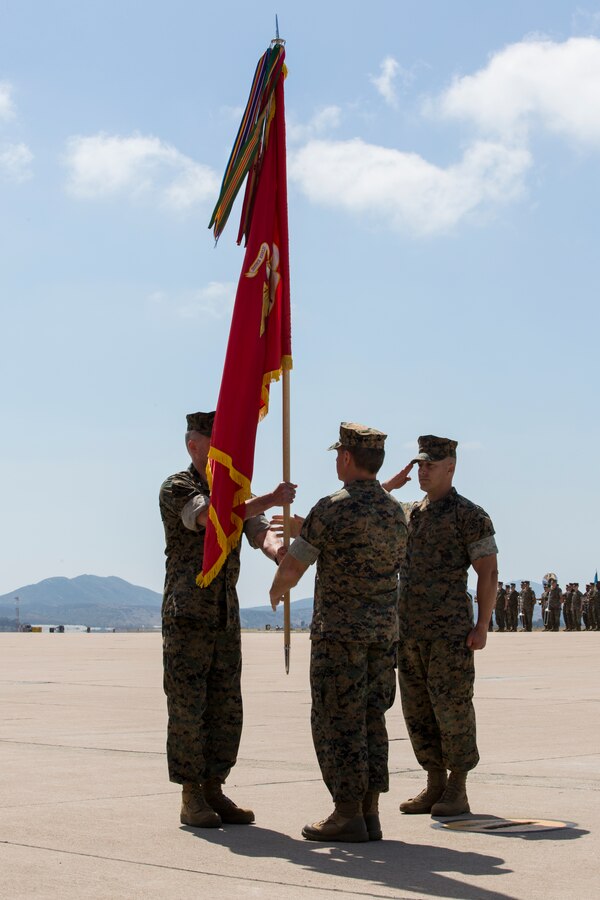 U.S. Marine Corps Col. Matthew R. Seay, outgoing commanding officer of Marine Wing Support Group (MWSG) 37, 3rd Marine Aircraft Wing, hands the unit colors to Col. Eric R. Quehl, oncoming commanding officer of MWSG-37, during a change of command on Marine Corps Air Station Miramar, Calif., June 14, 2019. During the ceremony, Seay was recognized for his leadership, service and dedication to the Corps. The unit also welcomed Quehl as the new commanding officer. (U.S. Marine Corps photo by Lance Cpl. Levi J. Guerra)