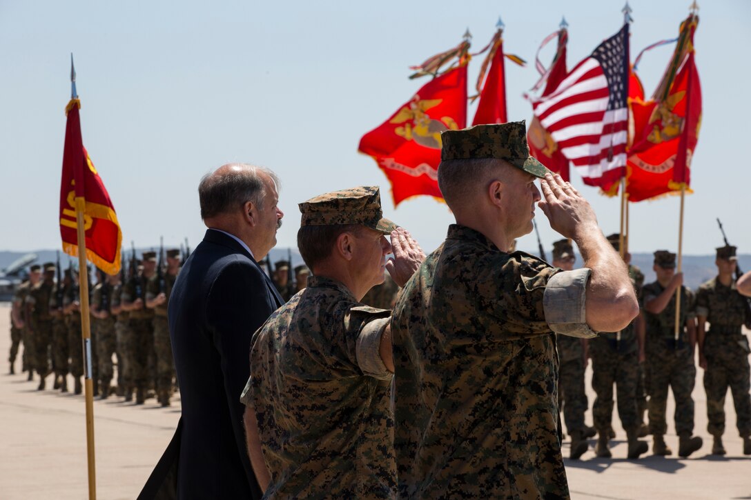 The previous and current commanding officers of Marine Wing Support Group (MWSG) 37 salute during a pass in review for a change of command ceremony on Marine Corps Air Station Miramar, Calif., June 14, 2019. During the ceremony, Col. Matthew R. Seay was recognized for his leadership, service and dedication to the Corps. The unit also welcomed Col. Eric R. Quehl as the new commanding officer. (U.S. Marine Corps photo by Lance Cpl. Levi J. Guerra)
