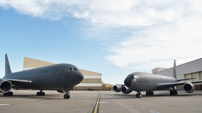 Past greets future.  A KC-46A Pegasus and KC-135 Stratotanker face each on Team McConnell's flightline, June 17, 2019, McConnell Air Force Base, Kan.  Team McConnell continues to lead the way with the introduction and implementation of the Air Force’s newest major weapons system, the KC-46.