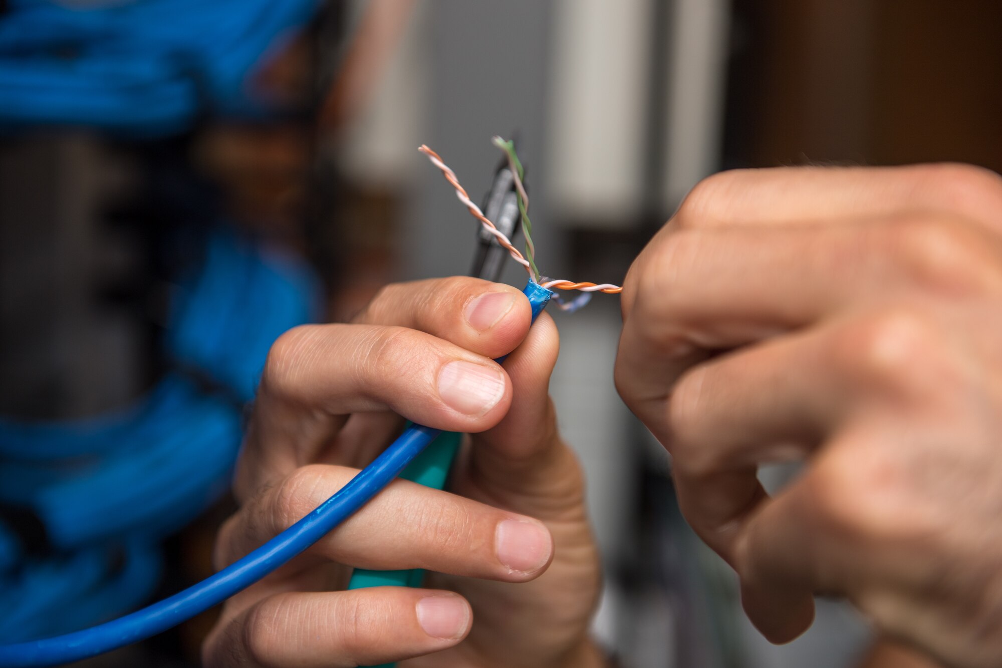 U.S. Air Force Tech. Sgt. Kenneth Overstreet, 178th Communications Squadron client systems from the Ohio Air National Guard, prepares a cable for connection at Tyndall Air Force Base, Florida, June 18, 2019.