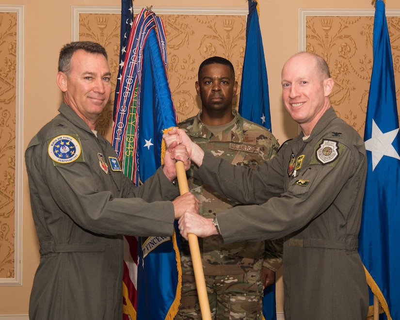U.S. Air Force Maj. Gen. Chad P. Franks, left, Ninth Air Force commander, assumes the guidon for the 1st Fighter Wing from Col. Jason T. Hinds, during a change of command ceremony at Joint Base Langley-Eustis, Virginia, June 21, 2019. Hinds will be going to serve at the Pentagon, Washington D.C. (U.S. Air Force photo by Airman 1st Class Marcus M. Bullock)