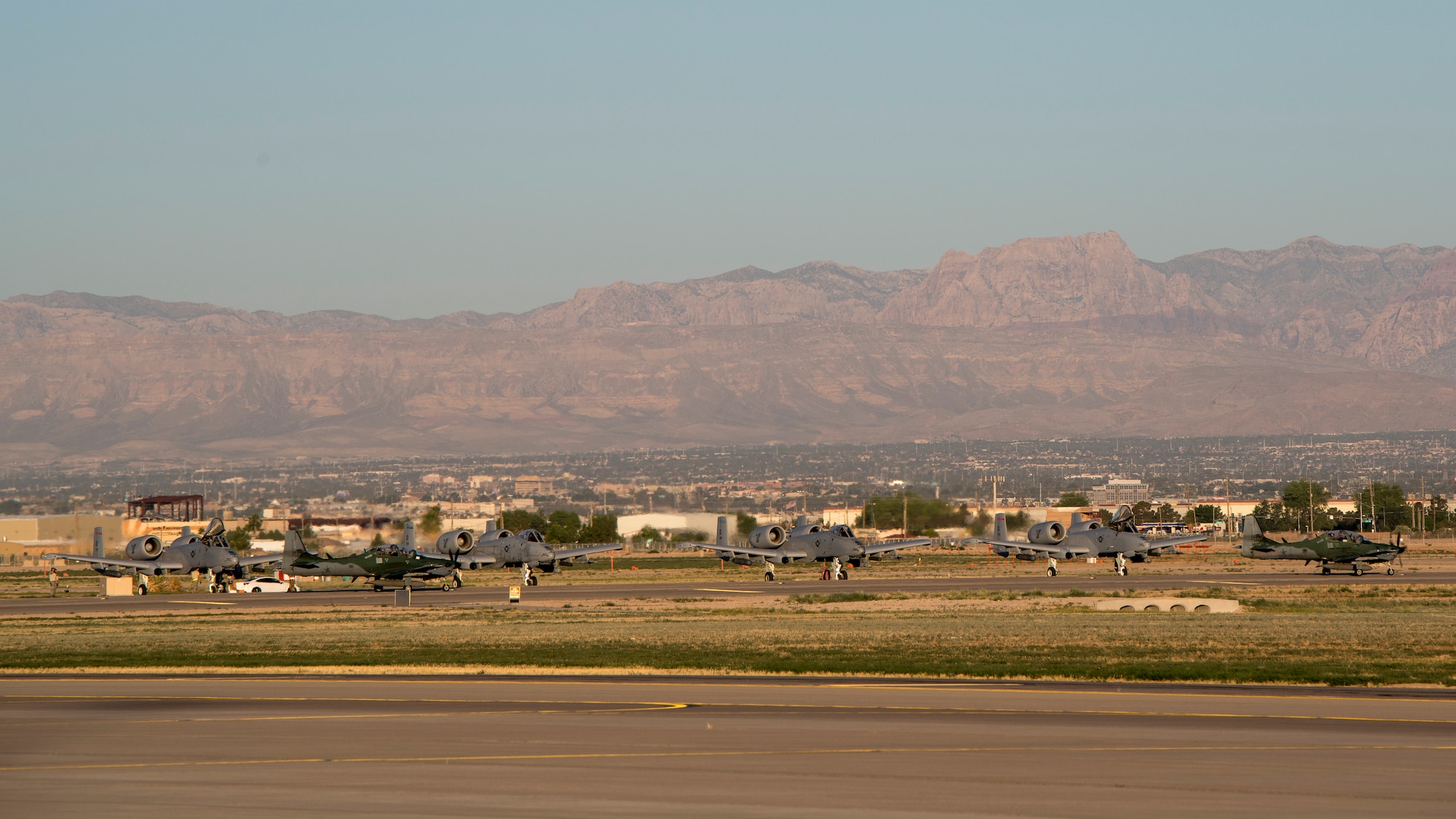 Brazilian A-29 Super Tucanos taxi past four A-10 Thunderbolt IIs from the 124th Fighter Wing, Boise, Idaho during Green Flag-West 19-8 at Nellis Air Force Base, Las Vegas, Nevada, June 8, 2019. The Idaho Air National Guard and Brazilians are working hand-in-hand to support the 116th Cavalry Brigade Combat Team during their National Training Center Rotation at Fort Irwin, California. (U.S. Air National Guard photo by Master Sgt. Joshua C. Allmaras)