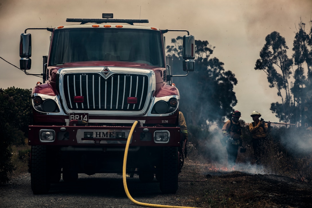 Firefighters from Marine Corps Air Station Miramar and local fire departments worked together to conduct a series of controlled burns on East Miramar, Calif., June 20. The controlled burns were conducted to mitigate the chance of wild fires starting on MCAS Miramar as well as provide real world training to local firefighters. (U.S. Marine Corps photo by Sgt. Jake McClung)