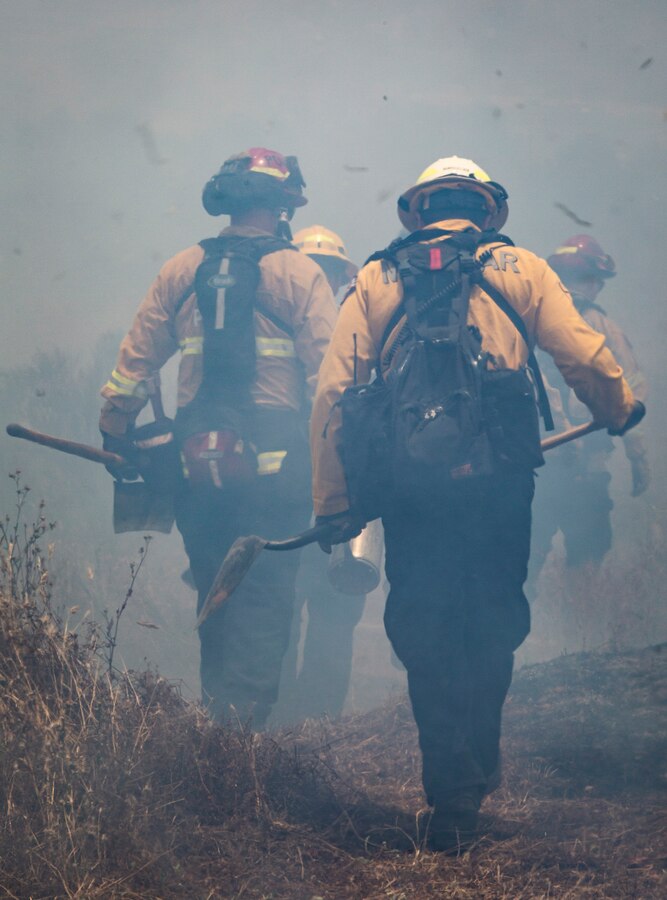 Firefighters from Marine Corps Air Station Miramar and local fire departments work together to conduct a series of controlled burns on East Miramar, Calif., June 20. The controlled burns were conducted to mitigate the chance of wild fires starting on MCAS Miramar as well as provide real world training to local firefighters. (U.S. Marine Corps photo by Sgt. Becky Cleveland)