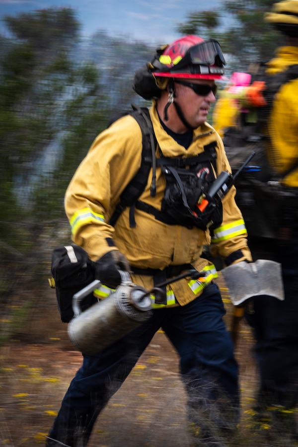 Firefighters from Marine Corps Air Station Miramar and local fire departments work together to conduct a series of controlled burns on East Miramar, Calif., June 20. The controlled burns were conducted to mitigate the chance of wild fires starting on MCAS Miramar as well as provide real world training to local firefighters. (U.S. Marine Corps photo by Sgt. Becky Cleveland)