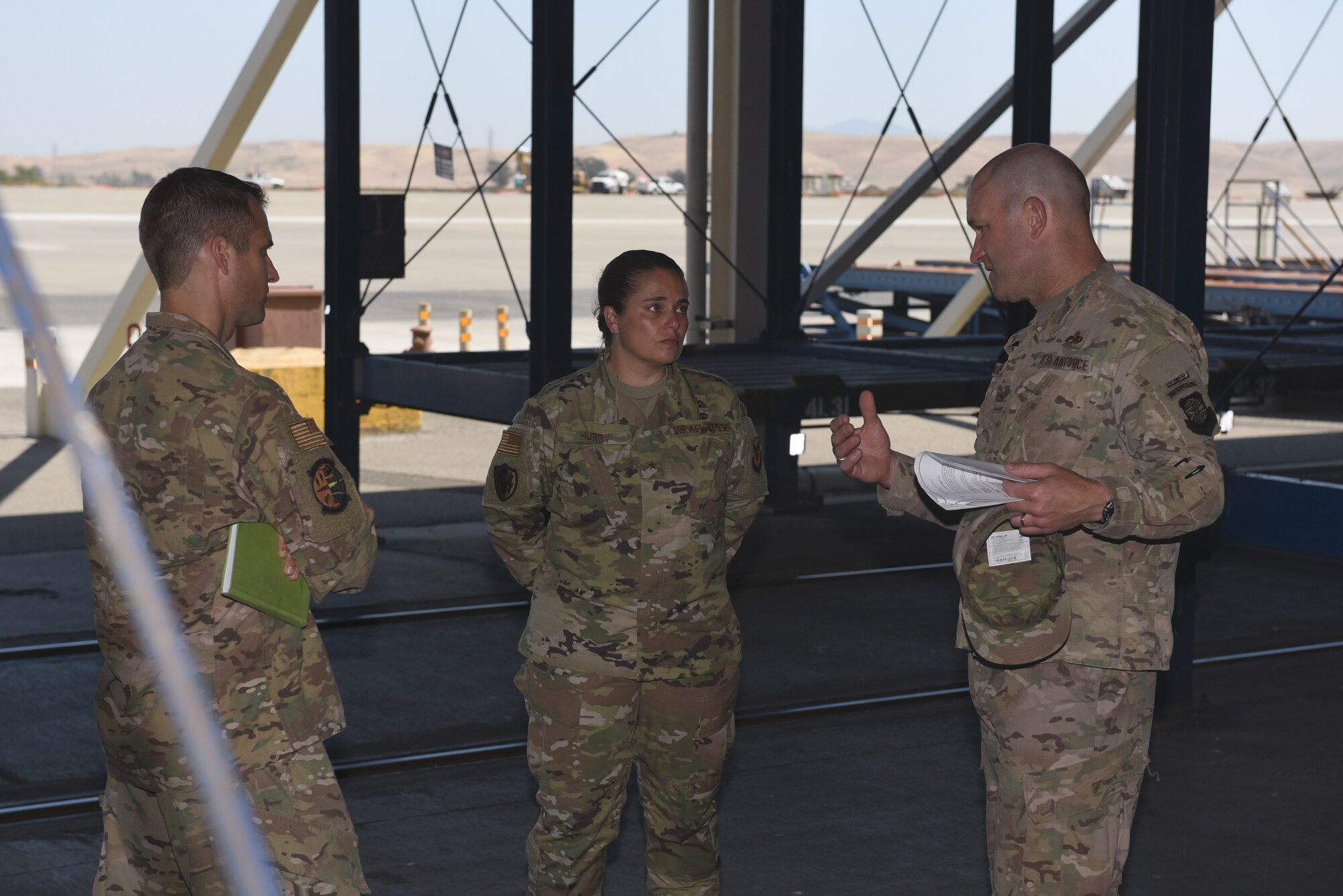 U.S. Air Force Col. David Hammerschmidt, 60th Maintenance Group commander, right, briefs Brig. Gen. Linda Hurry, Defense Logistics Agency Aviation commander, on maintenance operations June 17, 2019, at Travis Air Force Base, California. The general toured several units to learn firsthand about logistical operations and innovations at Travis. DLA Aviation is the combat logistics and supply chain manager for aviation and nuclear assets across the Department of Defense. (U.S. Air Force photo by Airman 1st Class Cameron Otte)