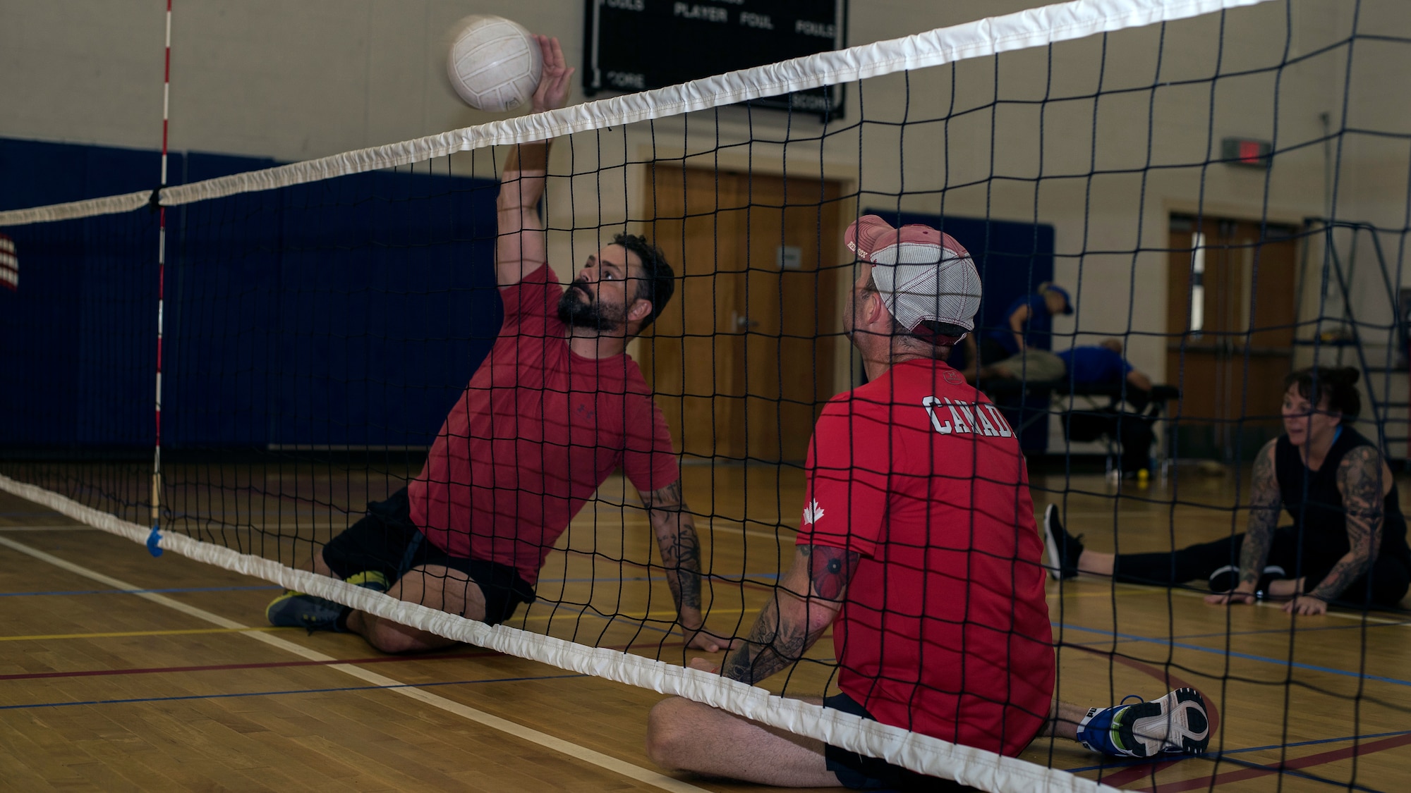 Canadian Armed Forces Warrant Officer Damien Pittman and Master Warrant Officer John O’Neill, wounded warrior athletes, practice sitting volleyball at MacDill Air Force Base, Fla., June 19, 2019.