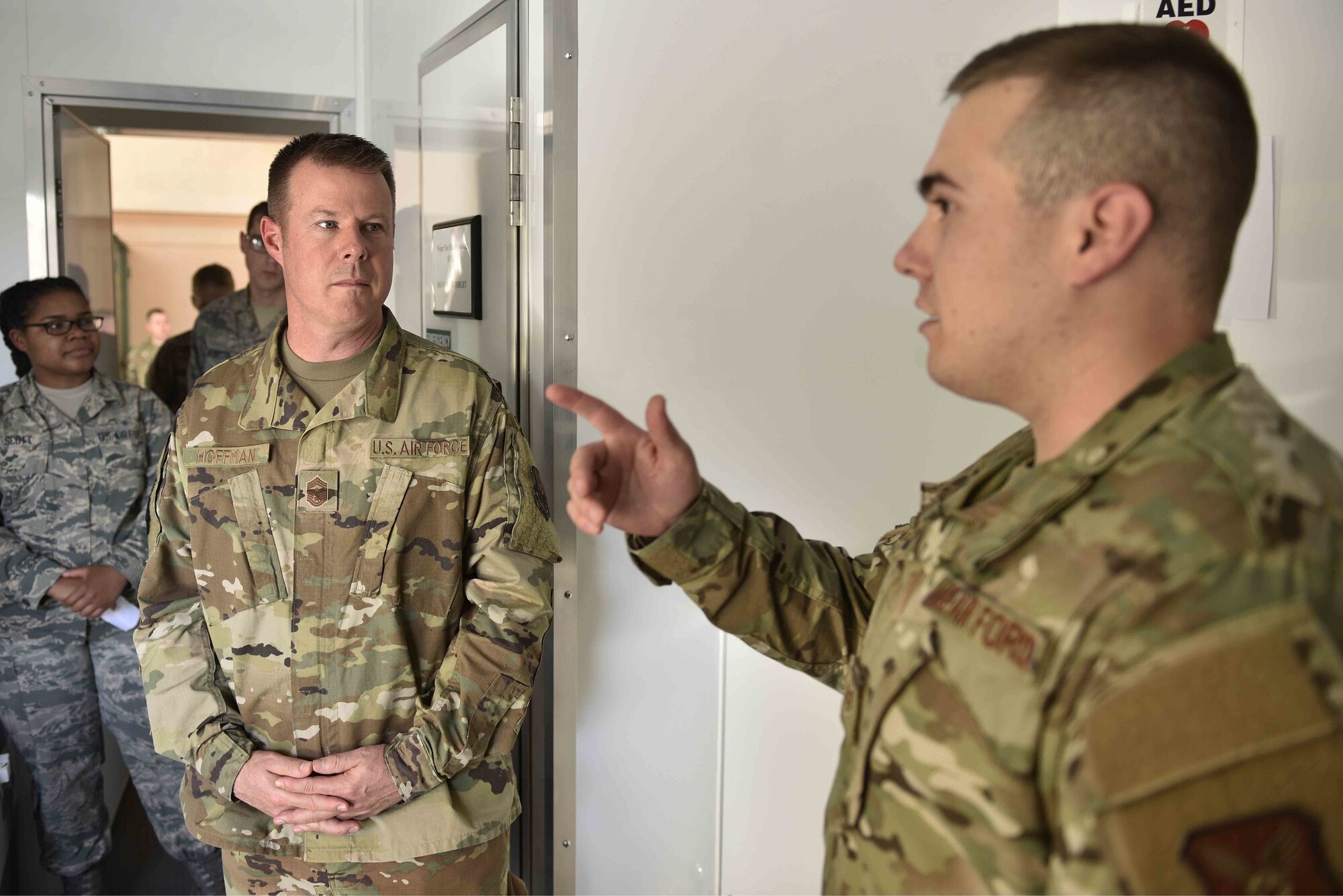 U.S. Air Force Chief Master Sgt. Charles Hoffman (left), Air Force Global Strike Command command chief, listens to Staff Sgt. Samuel Van Diest, non-commissioned officer in charge of medical logistics equipment, 377th Medical Support Squadron, talk about medical readiness at Kirtland Air Force Base, N.M., June 13, 2019. Hoffman visited with Airmen across the 377th Air Base Wing to learn more about them and their mission. (U.S. Air Force photo by Airman 1st Class Austin J. Prisbrey)