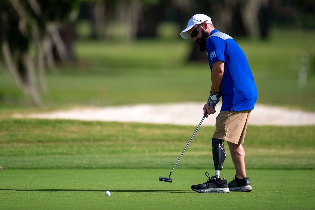 An airman playing golf.