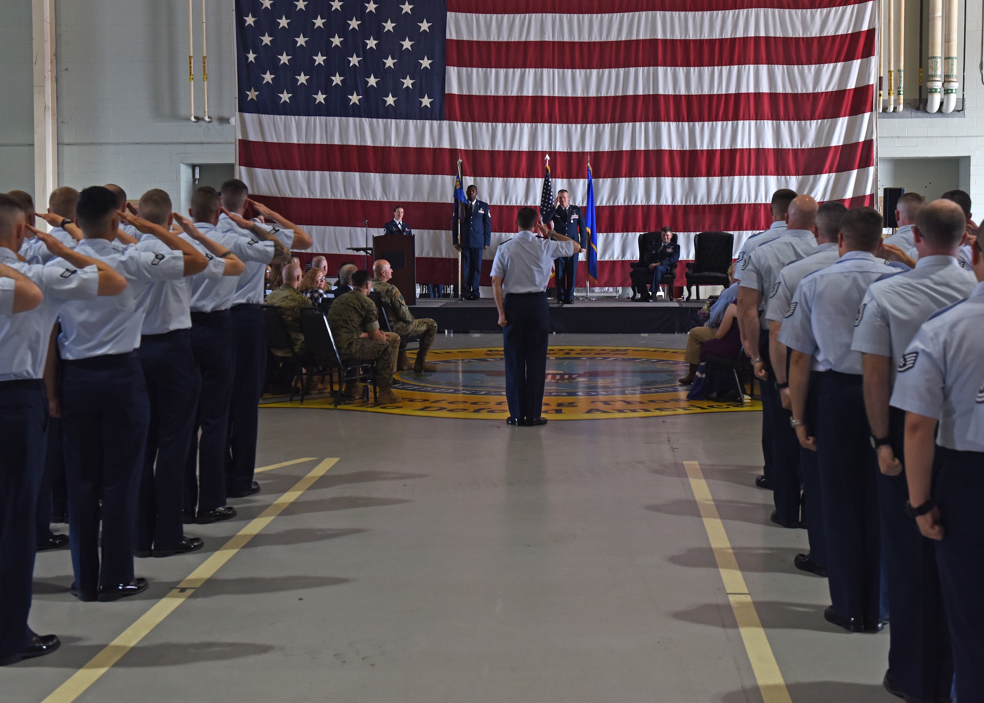 U.S. Air Force Lt. Col. Robert Kammerer, 316th Training Squadron outgoing commander, salutes members from the 316th TRS one last time during the change of command ceremony at the Louis F. Garland Department of Defense Fire Academy High Bay on Goodfellow Air Force Base, Texas, June 21, 2019. Permanent party and students came out to show their support and thank Kammerer for his time as commander. (U.S. Air Force photo by Airman 1st Class Zachary Chapman/Released)