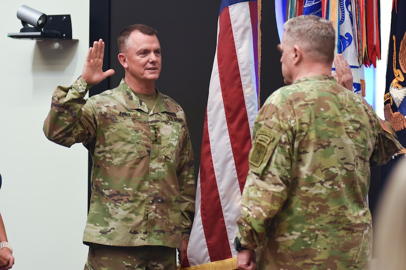Chief of Staff of the Army Gen. Mark A. Milley (right) administers the oath of commissioned officers to Gen. Paul E. Funk II during Funk's promotion ceremony at U.S. Army Training and Doctrine Command headquarters, Fort Eustis, Va., on June 21, 2019. Funk was promoted moments before he assumed command of TRADOC from Gen. Stephen J. Townsend.