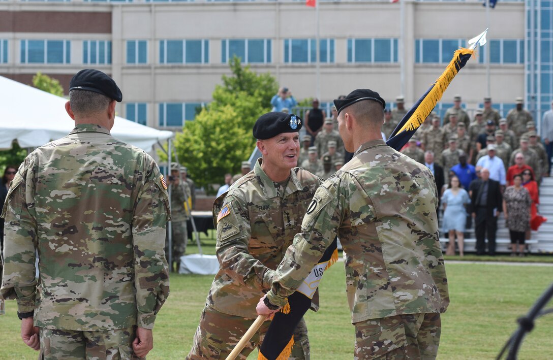 Gen. Paul E. Funk II, commanding general, U.S. Army Training and Doctrine Command, passes the colors to Command Sgt. Maj. Timothy Guden, during the TRADOC change of command ceremony held at the headquarters, Fort Eustis, Va., on June 21, 2019. Gen. Stephen Townsend, former commanding general, relinquished command to Funk during the ceremony, hosted by Chief of Staff of the Army Gen. Mark A. Milley. As TRADOC commander, Funk is responsible for 32 Army schools organized under eight Centers of Excellence that recruit, train and educate of more than 500,000 Soldiers and service members annually.