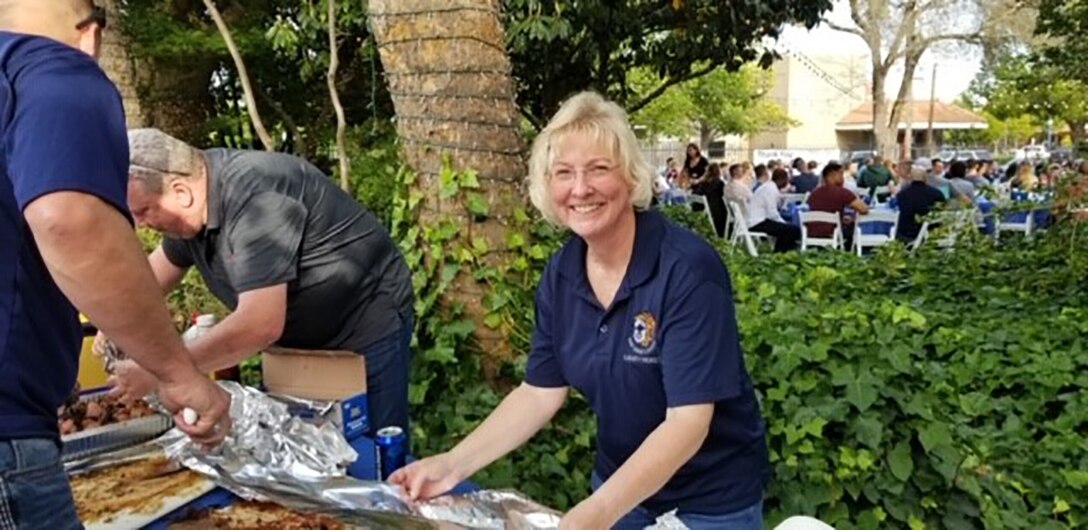 Team Travis Chiefs prepare the food for the NCO Appreciation Night.