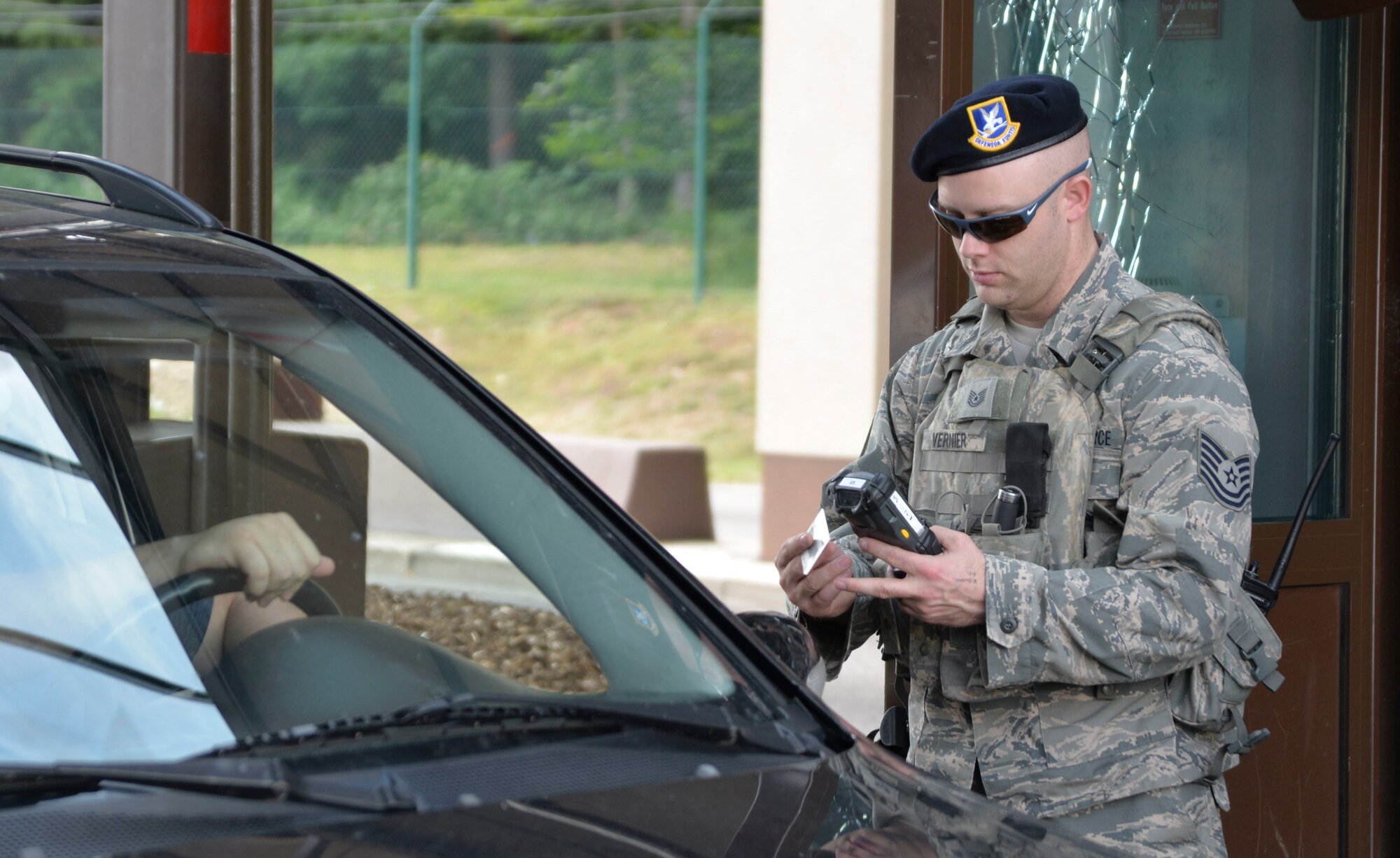 Airman ensures only authorized personnel are allowed access to the installation at Ramstein Air Base, Germany.