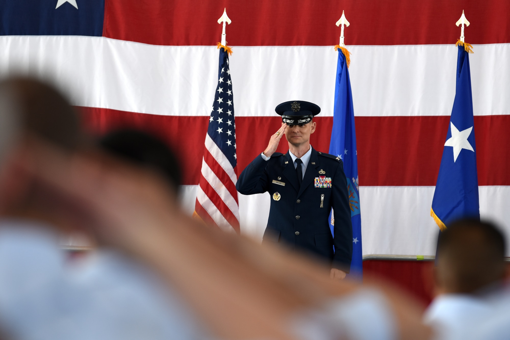 Col. David Miller, the new 377th Air Base Wing commander, receives his first salute from the Airmen of the 377th ABW during the change of command ceremony at Kirtland Air Force Base, N.M., June 21, 2019. Miller comes to Kirtland from Malmstrom AFB, Mont., where he was commander of the 341st Maintenance Group. (U.S. Air Force photo by Senior Airman Eli Chevalier)