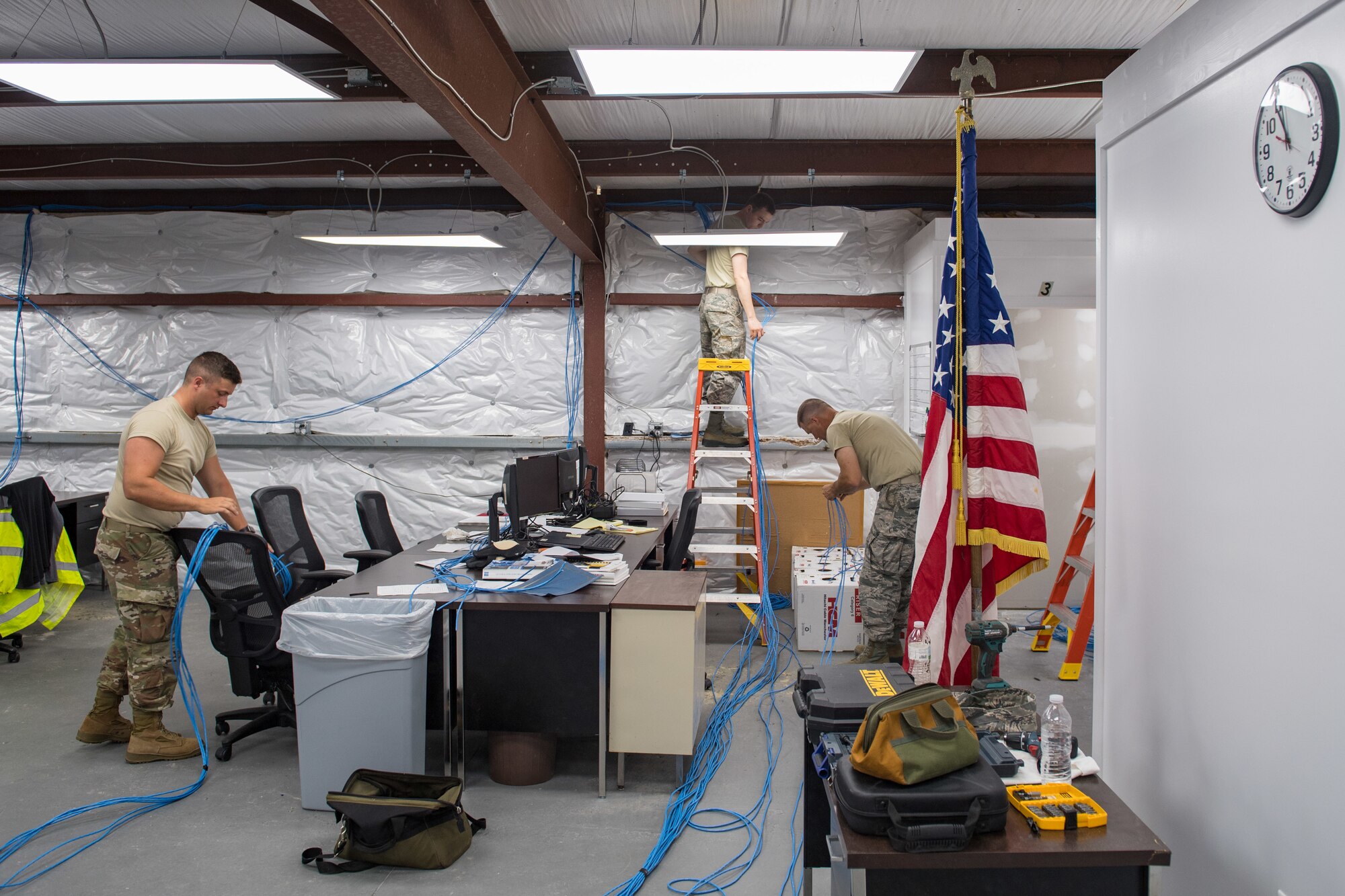 U.S. Air Force Airmen from the Ohio Air National Guard 178th Communications Squadron, install wires at Tyndall Air Force Base, Florida, June 18, 2019.