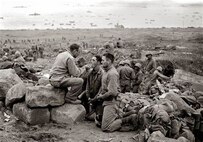 A U.S. Army Chaplain provides religious services for soldiers at Normandy, France, sometime after D-Day. This year marks the 75th anniversary of D-Day and was honored by U.S. Air Force Chaplain (Capt.) Lucas Dalgleish, 100th Air Refueling Wing chaplain, parachuting into Normandy, France, June 9, 2019, carrying a religious stole that began its ministry there 75 years ago. (Courtesy photo)