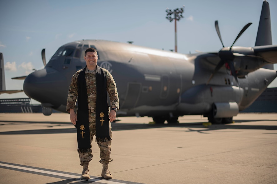 U.S. Air Force Chaplain (Capt.) Lucas Dalgleish, 100th Air Refueling Wing chaplain, poses for a photo in front of a U.S. Air Force MC-130J Commando II at RAF Mildenhall, England, June 6, 2019. Dalgleish parachuted into Normandy, France, during the 75th anniversary for D-Day while carrying a religious stole that started its ministry at the beaches of Normandy. (U.S. Air Force photo by Senior Airman Luke Milano)