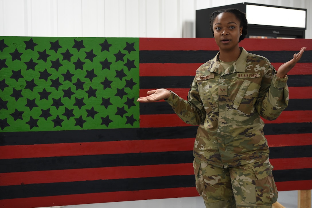 Senior Airman Hollye Ware, 380th Expeditionary Civil Engineer Squadron emergency management technician, kicks off the Juneteenth event by explaining the significance of the date in history at Al Dhafra Air Base, United Arab Emirates, June 19, 2019.