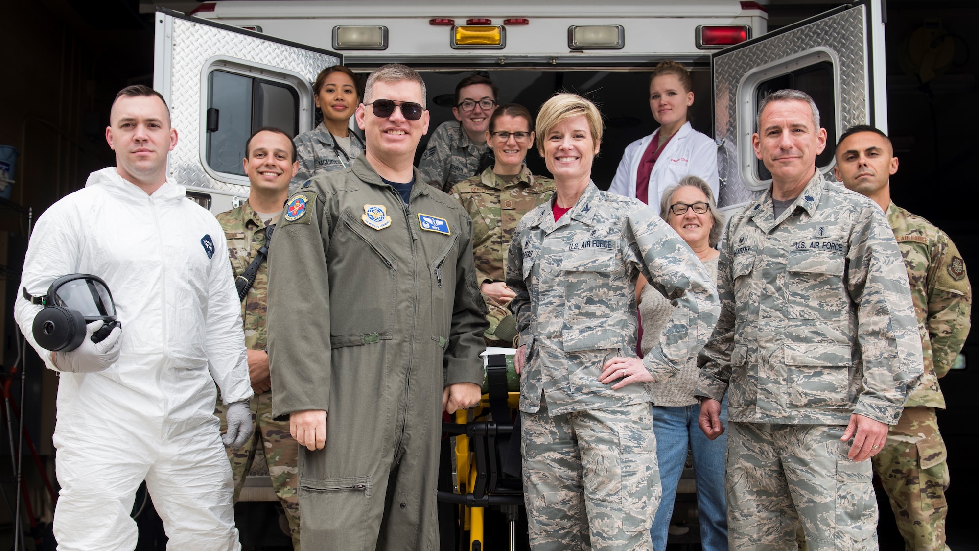 Col. Michaelle Guerrero, 92nd Medical Group commander, and Lt. Col. Daniel Hatcher, 92nd Aeromedical Squadron flight commander, pose with members from each area of the 92nd MDG during a group photo at Fairchild Air Force Base clinic, Washington, April 26, 2019. The 92nd MDG has operated for decades in support of Fairchild AFB's mission by delivering world-class health care in keeping Airmen and families ready to Fly, Fight and Win. (U.S. Photo by Senior Airman Ryan Lackey)