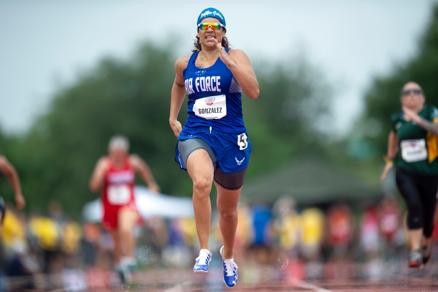 A female runner sprints the 100 yard dash during the 2019 DoD Warrior Games in Tampa, Fla.