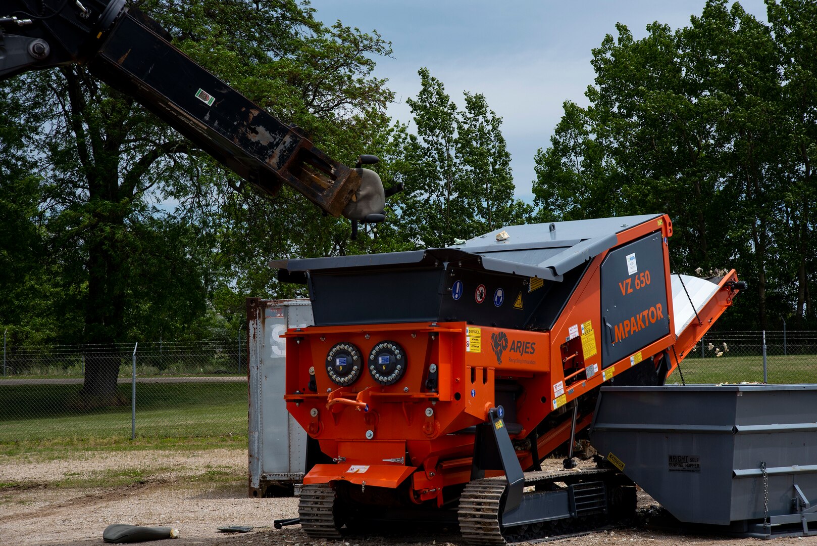 Participants of the Overseas Contingency Operations Readiness Training exercise shred office chairs in Battle Creek, Mich., June 14, 2019. OCORT prepares military and civilian agency personnel for constructing and manning portable disposal sites that can be shipped and used nearly anywhere in the world. (U.S. Air Force photo/Tech Sgt. Zachary Wolf)