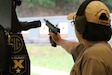 Staff Sgt. Sandra Uptagrafft (108th Training Command) firing at the 60th Annual Interservice Pistol Championship hosted and conducted by the U.S. Army Marksmanship Unit (USAMU) at Fort Benning.