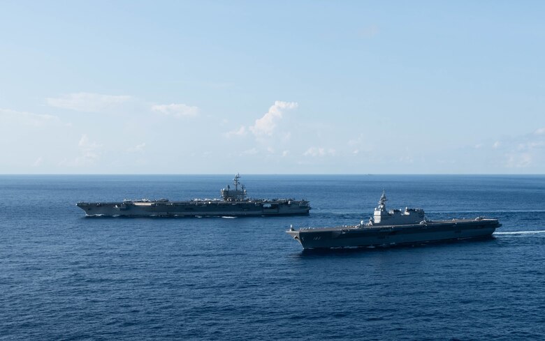 SOUTH CHINA SEA (June 19, 2019) The U.S. Navy’s forward-deployed aircraft carrier USS Ronald Reagan (CVN 76) sails alongside the Japan Maritime Self Defense Force helicopter destroyer JS Izumo (DDH 183) while conducting operations in the South China Sea. Ronald Reagan, the flagship of Carrier Strike Group 5, provides a combat-ready force that protects and defends the collective maritime interests of its allies and partners in the Indo-Pacific region.