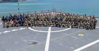 Multinational service members deployed as part of Pacific Partnership 2019 aboard the Military Sealift Command expeditionary fast transport ship USNS Brunswick (T-EPF 6) pose for a photo on the flight deck alongside Brunswick crew during Pacific Partnership 2019. (U.S. Navy photo by Mass Communication Specialist 3rd Class Chanel Turner)