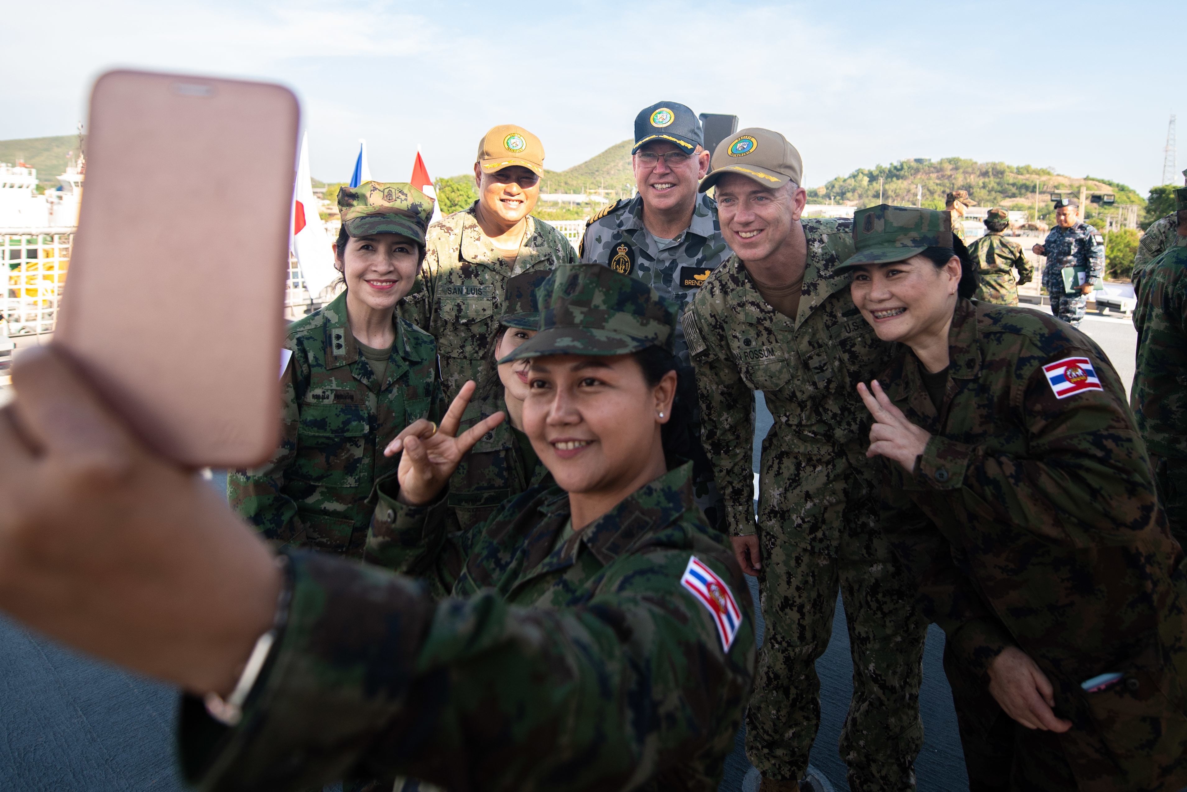Members of the Royal Thai Armed Forces pose for a selfie with U.S. Navy Capt. Randy Van Rossum, Pacific Partnership 2019 (PP19) mission commander, Royal Australian Navy Capt. Brendon Zilko, PP19 chief of staff, and U.S. Navy Cdr. Edgar San Luis during the PP19 opening ceremony for Thailand. (U.S. Navy photo by Mass Communication Specialist 2nd Class Nicholas Burgains)