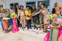 Pacific Partnership 2019 (PP19) leaders cut a ribbon at a ceremony that marks the completion of a library, also designed to function as a shelter in the event of a natural disaster, constructed at Ban Surasak School by engineers from PP19 partner nations. (U.S. Navy photo by Mass Communication Specialist 1st Class Nathan Carpenter)