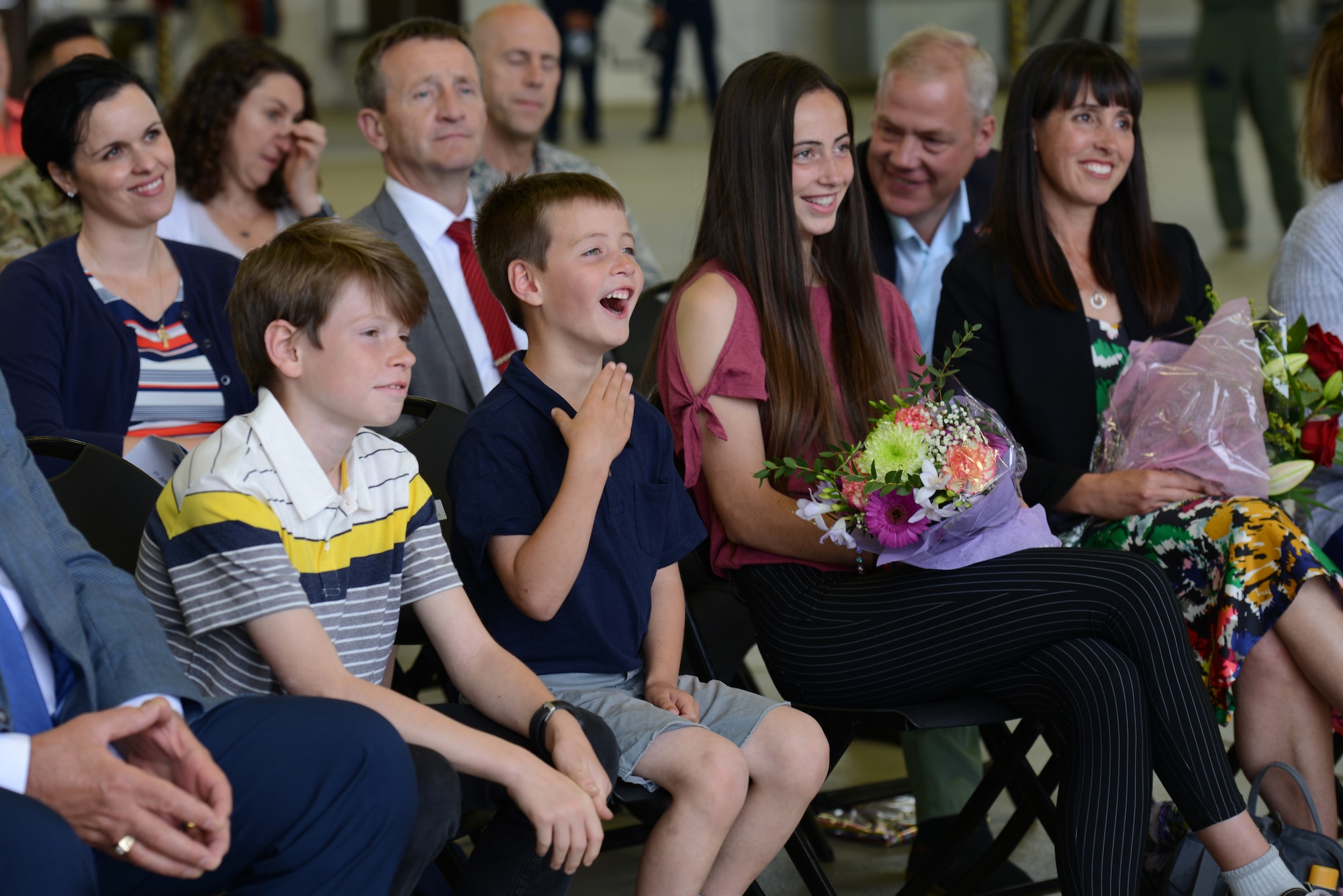 The family of retired U.S. Air Force Col. Joseph Wenckus, former 86th Airlift Wing vice commander, smile during his retirement ceremony on Ramstein Air Base, Germany, June 11, 2019. Wenckus served as the vice wing commander for two years. (U.S. Air Force photo by Airman 1st Class Jennifer J. Gonzales)