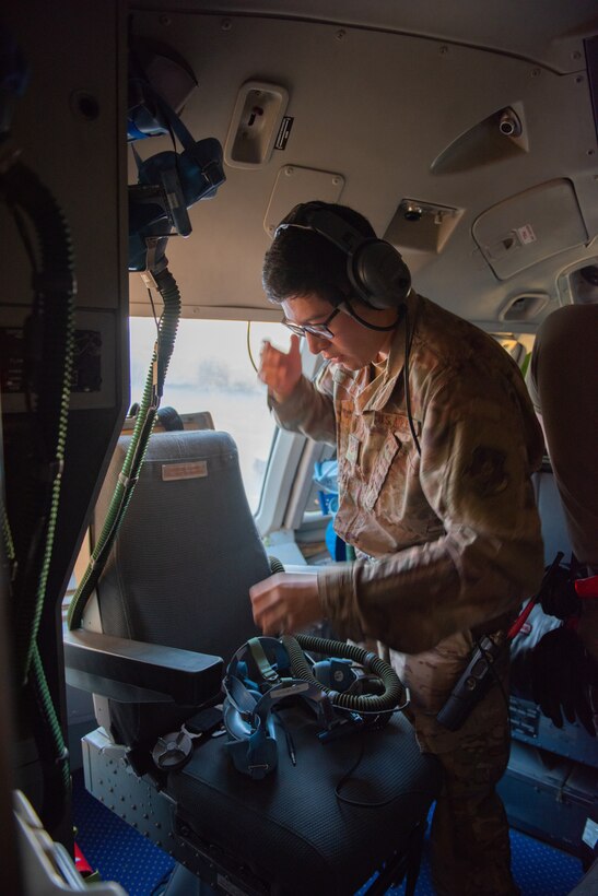 Senior Airman Renato Avalos, 380th Expeditionary Operations Support Squadron KC-10 Extender aircrew flight equipment technician, tests the communication function on an oxygen mask June 19, 2019, at Al Dhafra Air Base, United Arab Emirates.