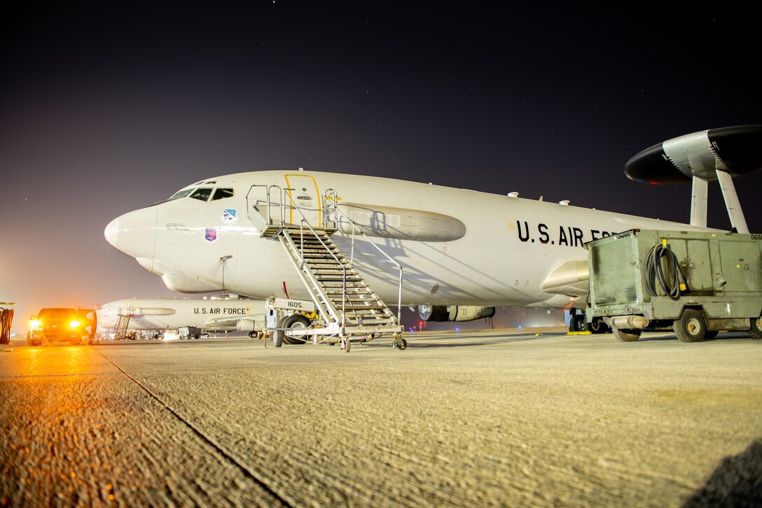 Aircrew flight equipment technicians leave an E-3 Sentry after replacing old life preservation units with new and better designed units June 19, 2019, at Al Dhafra Air Base, United Arab Emirates.