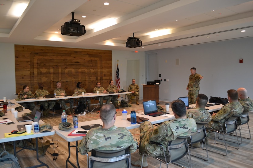 Brig. Gen. Aaron Walter, commander of the 100th Training Division-Leader Development, visits the officers attending the Command and General Staff College Phase Two 4x4 Course at Fort Belvoir, Virginia, June 10, 2019. The 4x4 course is a pilot program that allows Army officers to complete the second of three phases in person during four weekends instead of the previous option of eight weekend classes or through distance learning.