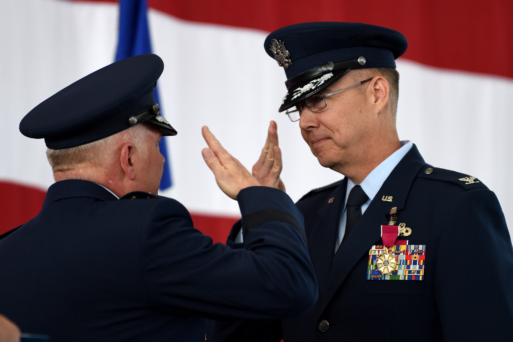 Col. Richard Gibbs, former 377th Air Base Wing commander, is awarded a Legion of Merit by Maj. Gen. Ferdinand B. Stoss III, 20th Air Force commander, during the 377th ABW Change of Command Ceremony at Kirtland Air Force Base, N.M., June 21, 2019. Gibbs, selected for brigadier general, will head to Air Mobility Command and Scott AFB, Ill., where he will become the A4 Director of Logistics, Engineering, and Force Protection. (U.S. Air Force photo by Senior Airman Eli Chevalier)