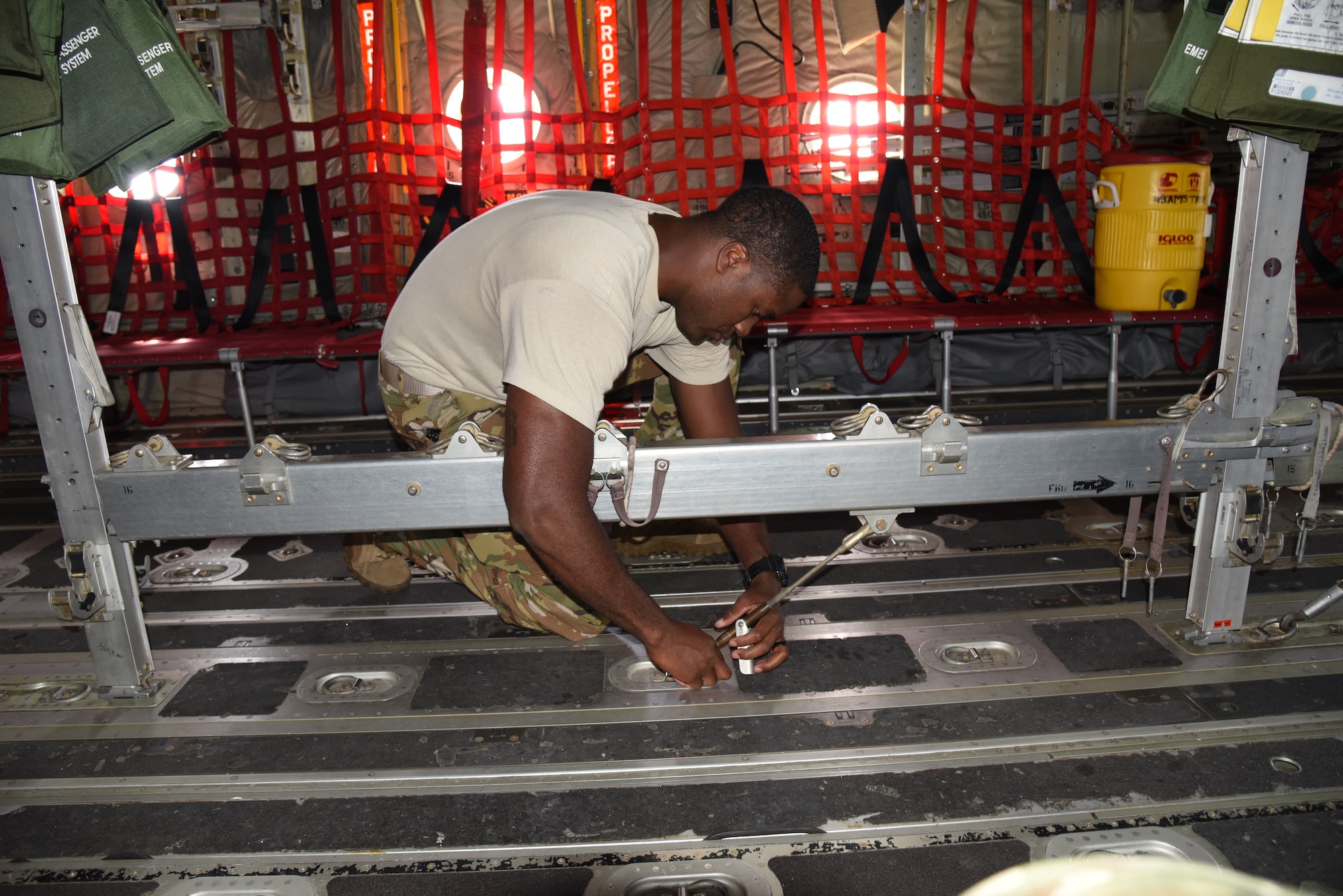 Tech. Sgt. Gary Bryant, a loadmaster with the 815th Airlift Squadron, 403rd Wing, installs the seating on the C-130J in preparation for paratroopers to use for exercise Swift Response 19, June 12, 2019. The exercise is one of the premier military crisis response training events featuring high readiness airborne forces from eight NATO nations. Activities include intermediate staging base operations, multiple airborne operations, and several air assault operations. The Swift Response exercises have had great success in creating a foundation for the strong relationships we share with several European allies and partners today. (U.S. Air Force photo by Master Sgt. Jessica Kendziorek)
