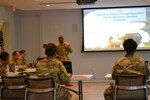 Brig. Gen. Aaron Walter, commander of the 100th Training Division-Leader Development, visits the officers attending the Command and General Staff College Phase Two 4x4 Course at Fort Belvoir, Virginia, June 10, 2019. The 4x4 course is a pilot program that allows Army officers to complete the second of three phases in person during four weekends instead of the previous option of eight weekend classes or through distant learning.