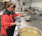 Margarita Reed, a cook at Brooke Army Medical Center’s dining facility, cleans the flattop cooker following breakfast June 21. BAMC earned three Practice Greenhealth Environmental Awards at the CleanMed2019 conference, including its first Circle of Excellence-Chemicals Award, for its overall commitment to environmental stewardship and sustainability practices.