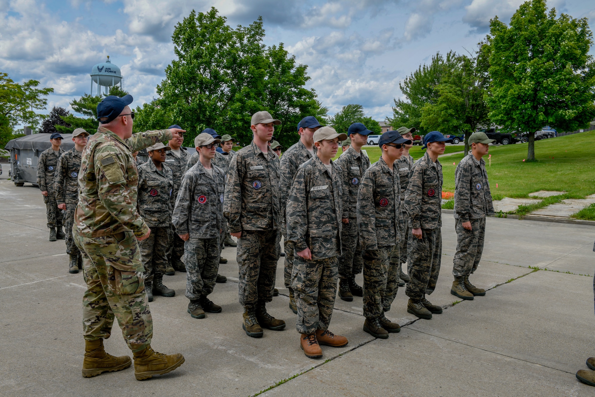 U.S. Air Force Senior Airman Alec Kovac, a 910th Airlift Wing Junior Reserve Officer Training Corps leadership camp instructor, instructs cadets to stand at the position of attention on June 14, 2019 at Youngstown Air Reserve Station.