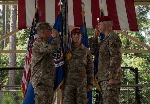 U.S. Air Force Col. Matt Allen, right, commander of the 24th Special Operations Wing, salutes U.S. Air Force Lt. Gen. Brad Webb, left, commander of Air Force Special Operations Wing, after receiving the unit guidon during an assumption of command ceremony at Hurlburt Field, Florida, June 24, 2019. Allen is the fifth person to command the 24th SOW, the Air Force’s sole Special Tactics wing. The wing is U.S. Special Operations Command’s tactical air-to-ground integration force and the Air Force’s special operations ground force. (U.S. Air Force photo by Senior Airman Rachel Yates)