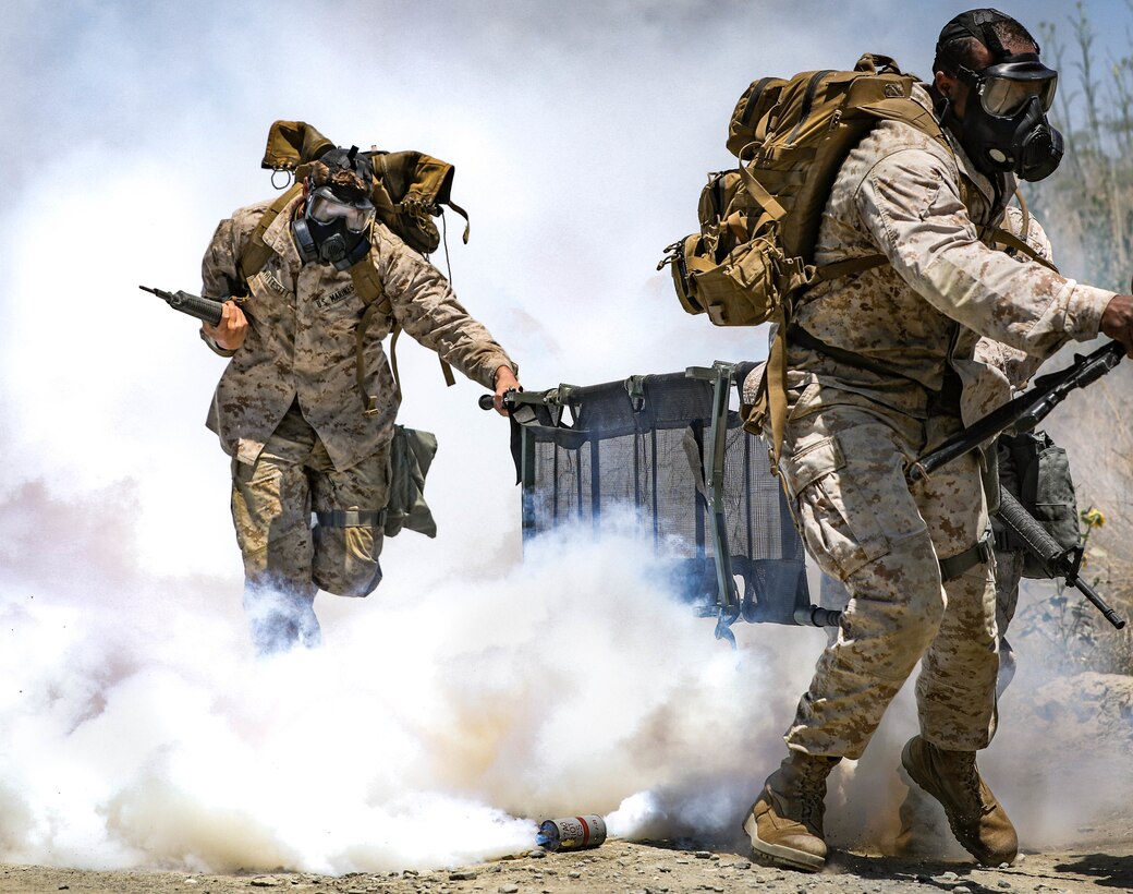 U.S. Marines with 3rd Platoon, 11th Marine Regiment, 1st Marine Division, run during a simulated chemical, biological, radioactive, and nuclear attack for the Command Sponsored Corporals Course, at Marine Corps Base Camp Pendleton, California, June 19, 2019. The CSCC was hosted by 11th Marine Regiment, 1st Marine Division, to provide students with basic knowledge and skills to become successful small-unit leaders.
