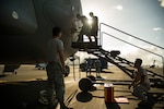 Maintainers from the 15th Maintenance Group and members from the 36th Squadron from Royal Australian Air Force Base Amberley, perform maintenance on a C-17 Globemaster on Joint Base Pearl Harbor-Hickam, Hawaii, July 12, 2017.