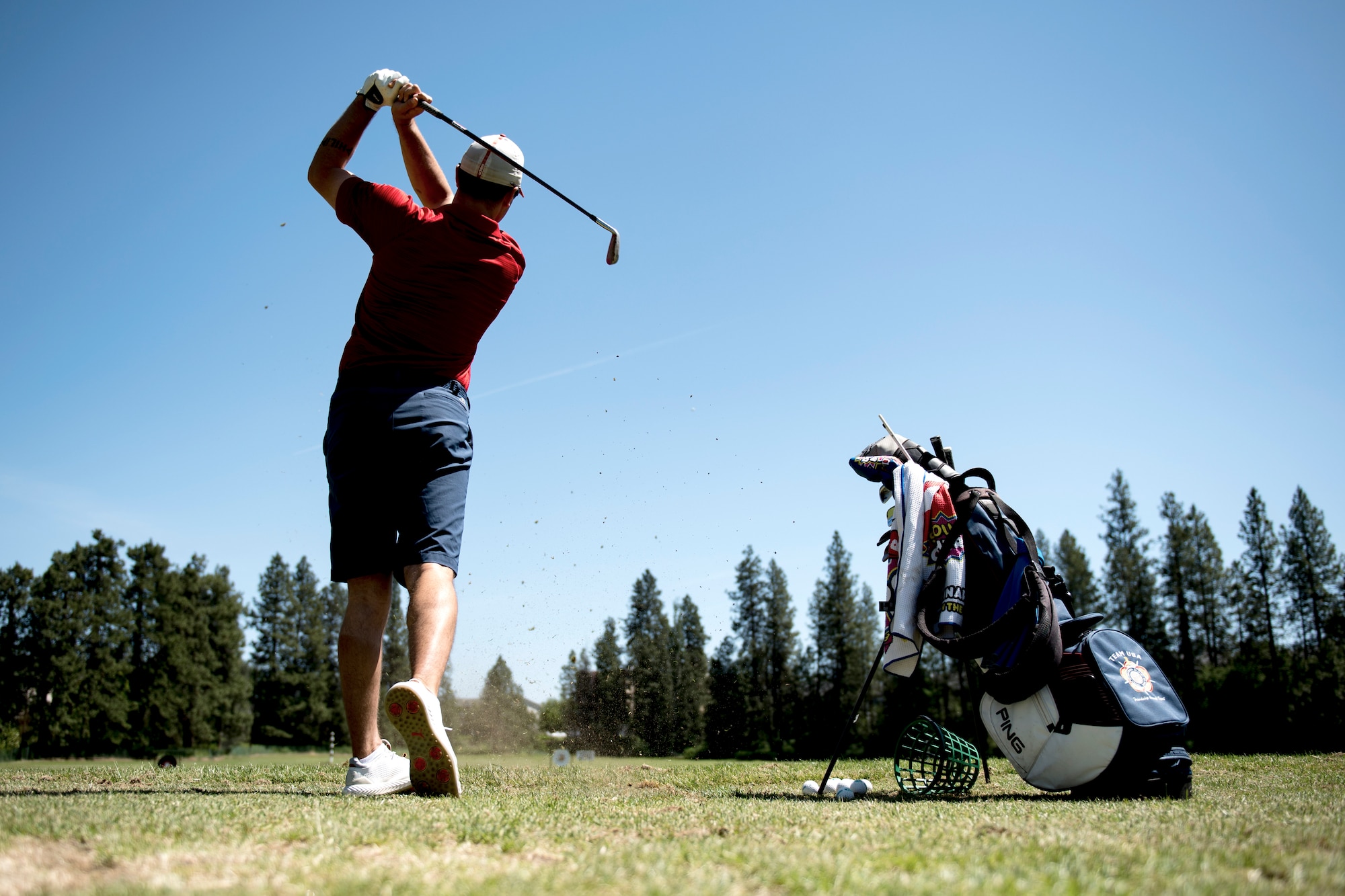 U.S. Air Force Staff Sgt. Dolton Dishman, 92nd Operations Support Squadron flotation equipment NCO in charge, practices on the Indian Canyon Golf Course driving range in Spokane, Washington, May 14, 2019. The Air Force Sports Organization promotes Airmen to participate and excel in personal sporting activities around the world through the International Military Sports Council. (U.S. Air Force photo by Airman 1st Class Whitney Laine)