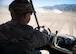 Explosive Ordnance Disposal technician drives a vehicle off road.